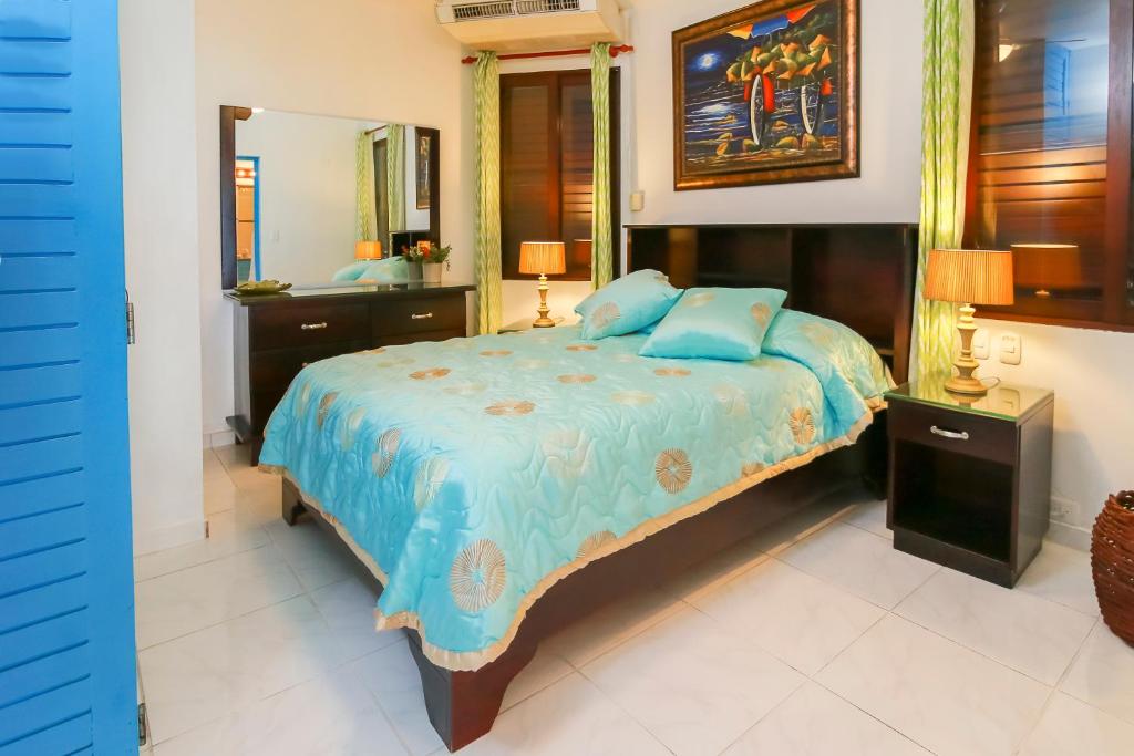 Postel nebo postele na pokoji v ubytování Cabarete Palm Beach Condos