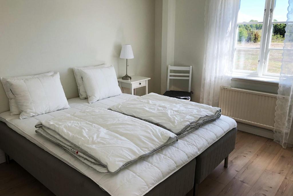 Postel nebo postele na pokoji v ubytování Warfsholm