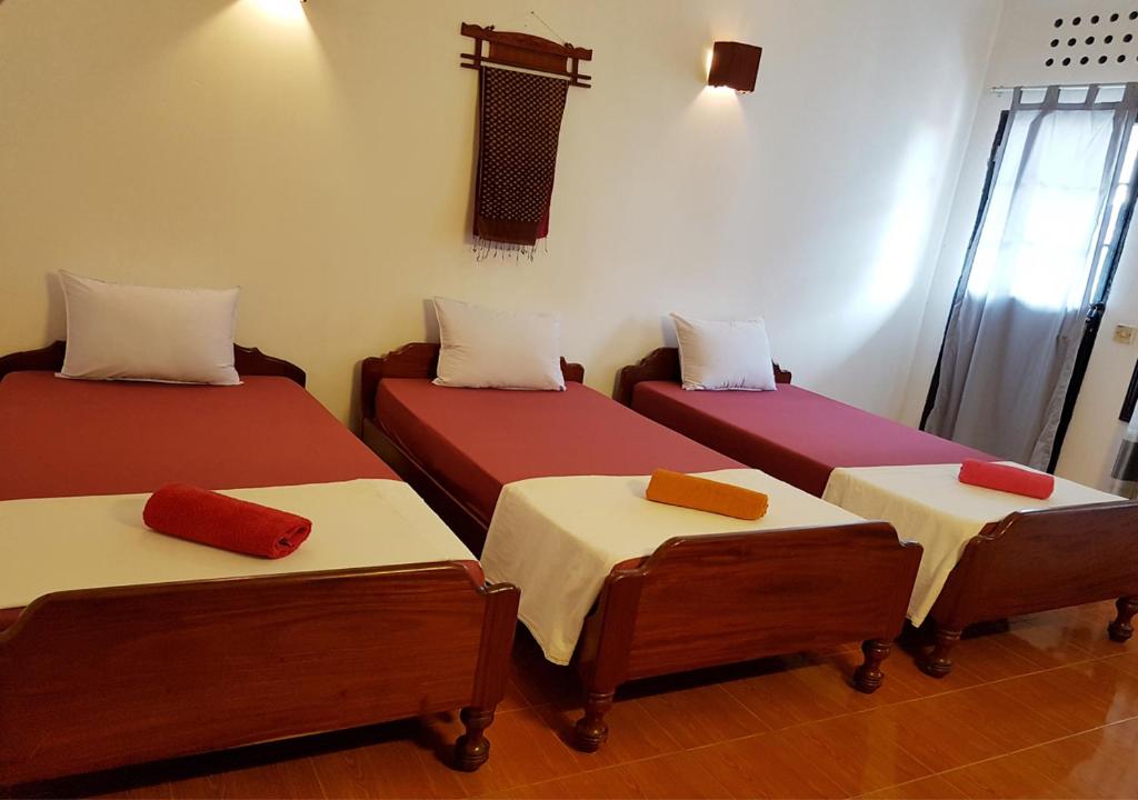 Postel nebo postele na pokoji v ubytování Smiley's Guesthouse