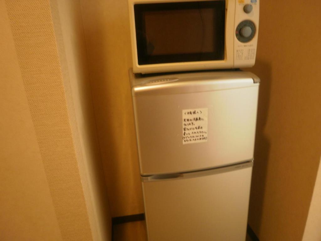 Kuchyň nebo kuchyňský kout v ubytování Kakiya Ryokan