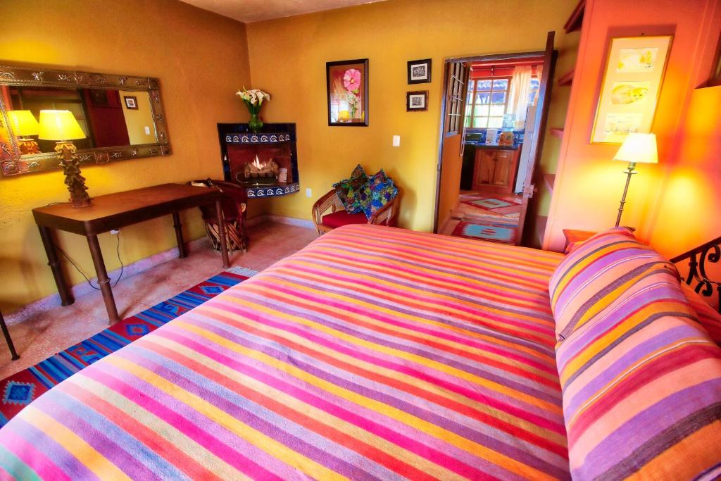 Postel nebo postele na pokoji v ubytování Hotel Casa Encantada