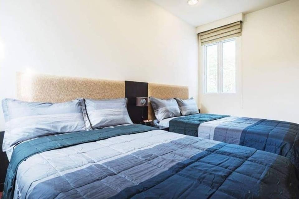 Postel nebo postele na pokoji v ubytování Blue Lagoon Hua Hin - Sea Renity Villa