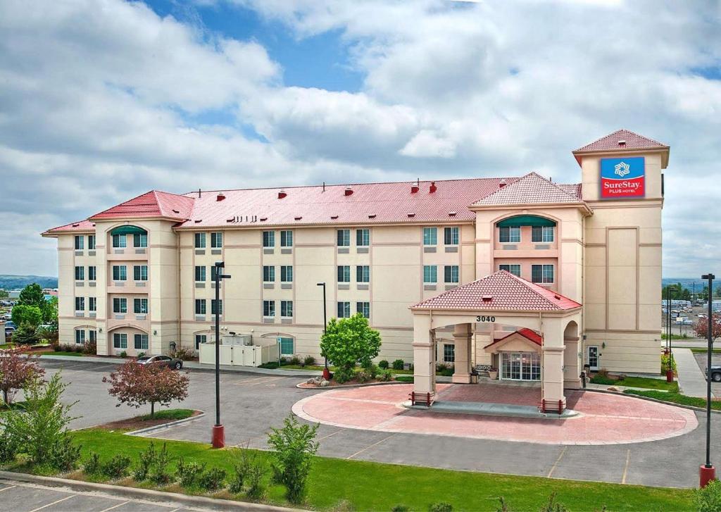 a large building with a clock tower on top of it at SureStay Plus Hotel by Best Western Billings in Billings