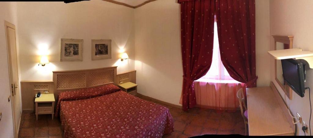 TV a/nebo společenská místnost v ubytování Hotel Quadrifoglio by Mancini