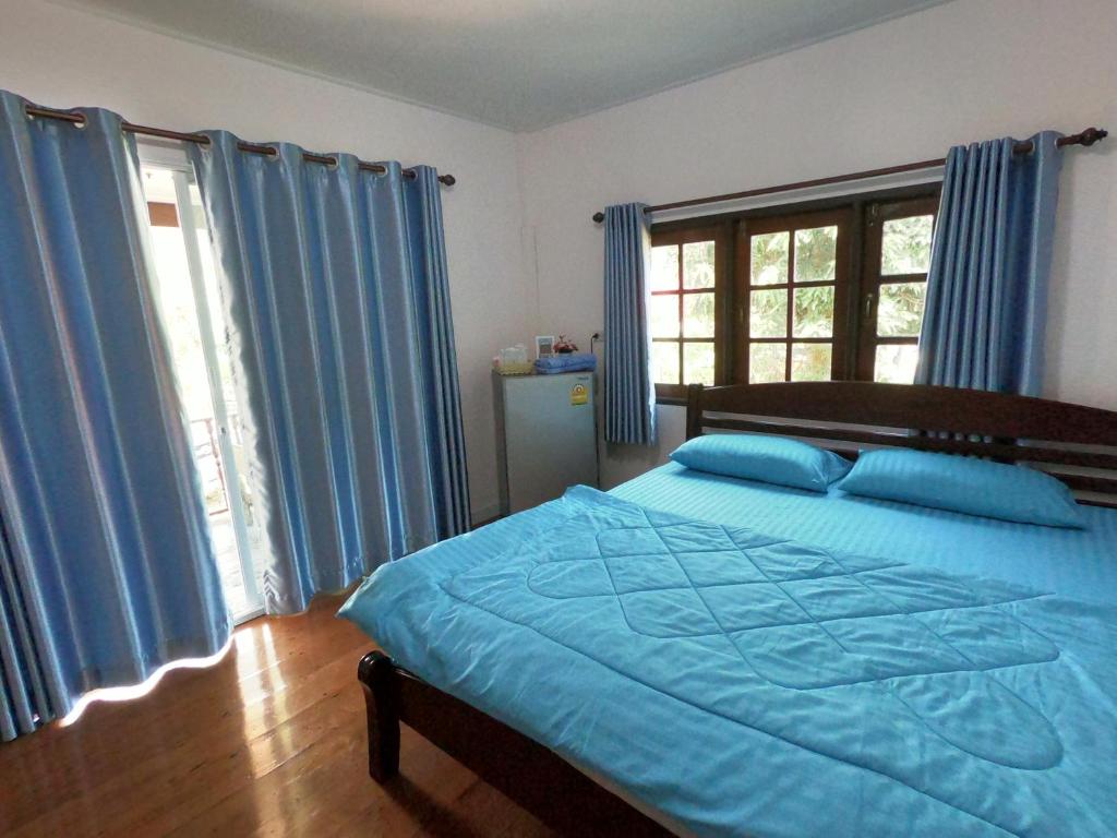 Postel nebo postele na pokoji v ubytování Thongsuwan Resort