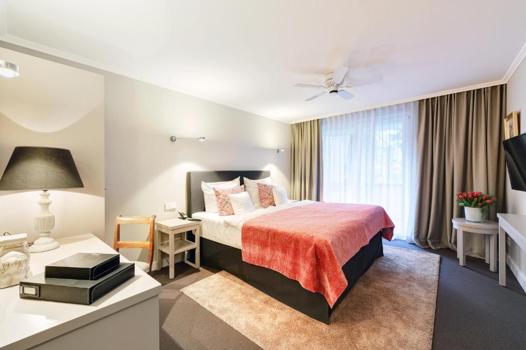 Postel nebo postele na pokoji v ubytování Hotel Admiral