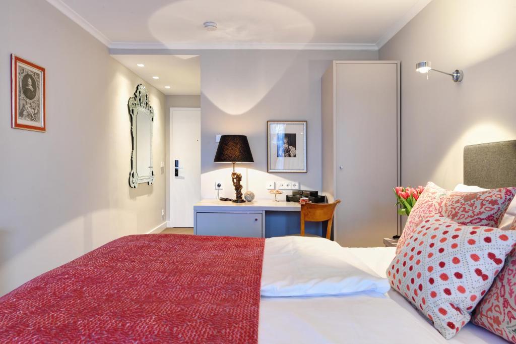 Postel nebo postele na pokoji v ubytování Hotel Admiral