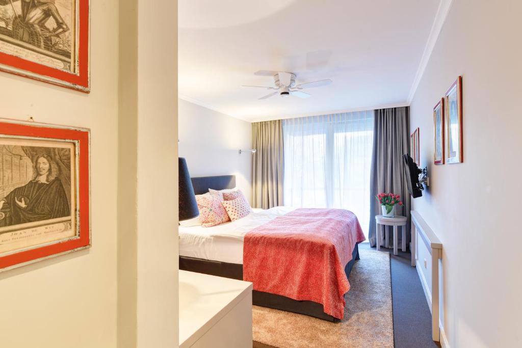 Postel nebo postele na pokoji v ubytování Hotel Admiral