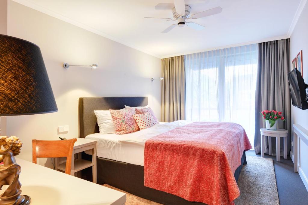 Postel nebo postele na pokoji v ubytování Hotel Admiral