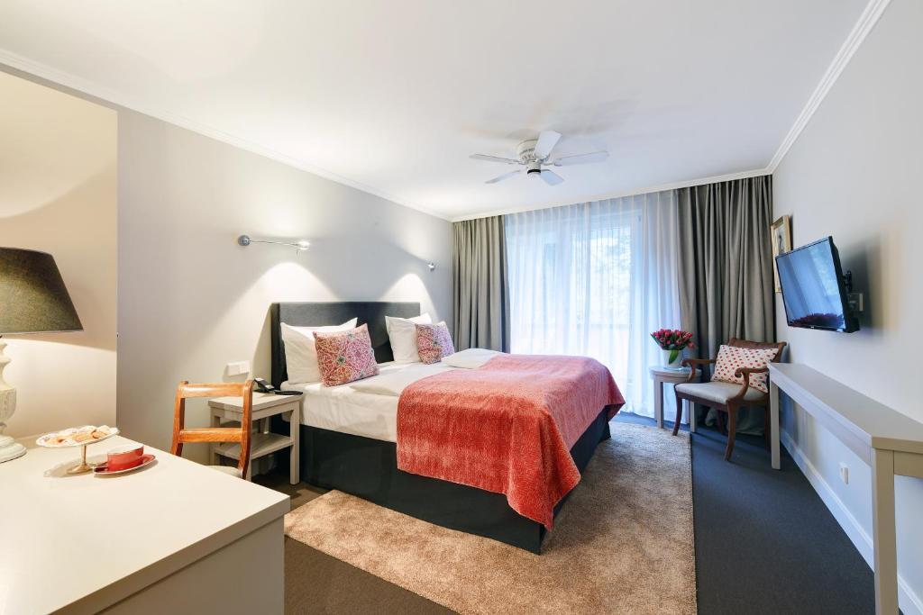 Postel nebo postele na pokoji v ubytování Hotel Admiral