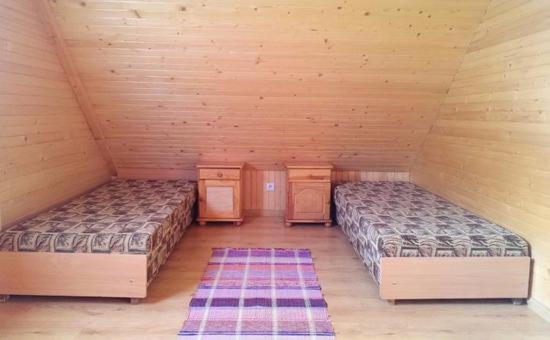 Postel nebo postele na pokoji v ubytování Chata pod pilskom