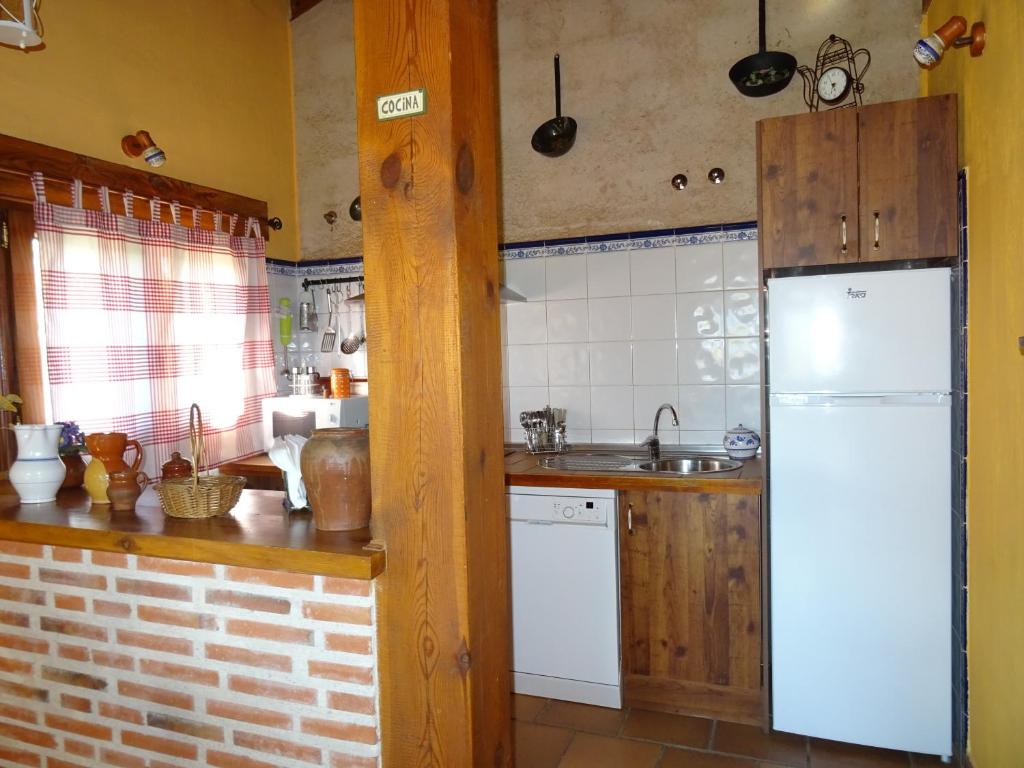 Kuchyň nebo kuchyňský kout v ubytování Balcon De Nut I y II