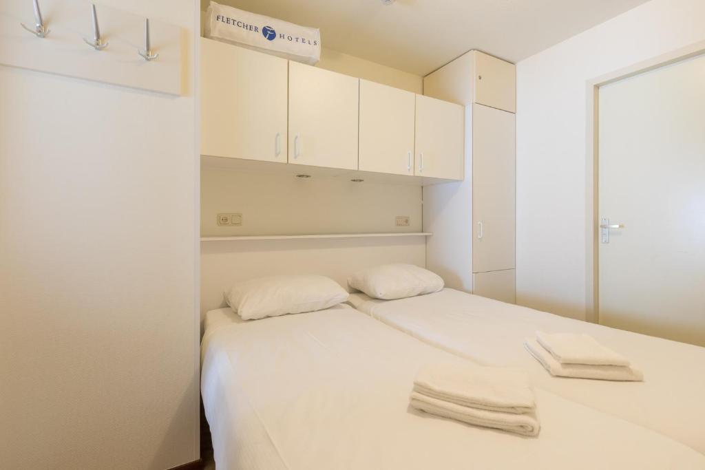Postel nebo postele na pokoji v ubytování Fletcher Hotel-Restaurant Amelander Kaap