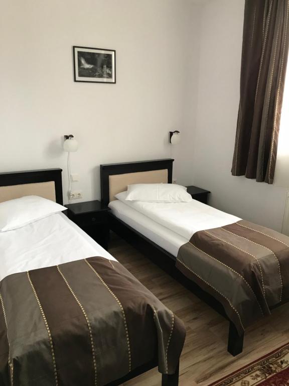 Postel nebo postele na pokoji v ubytování Farkas Panzió