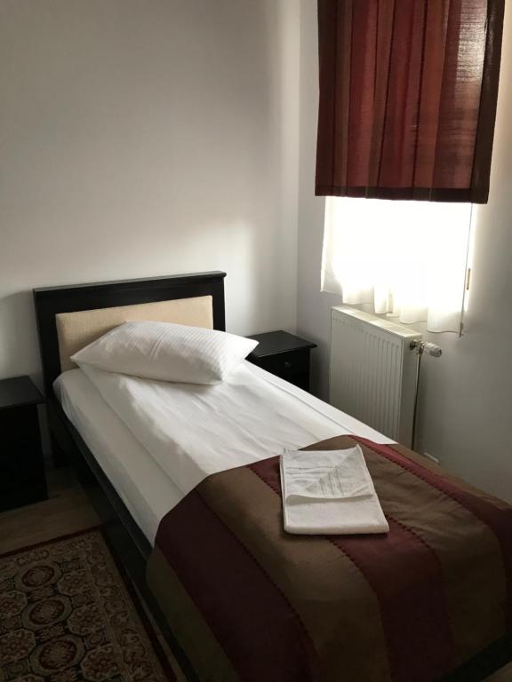 Postel nebo postele na pokoji v ubytování Farkas Panzió