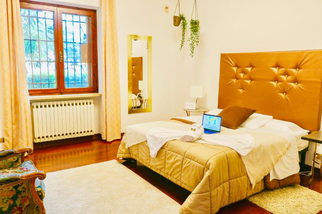 Postel nebo postele na pokoji v ubytování Vitti's Home Verona
