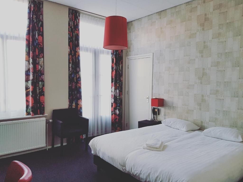 Postel nebo postele na pokoji v ubytování Hotel Zilt