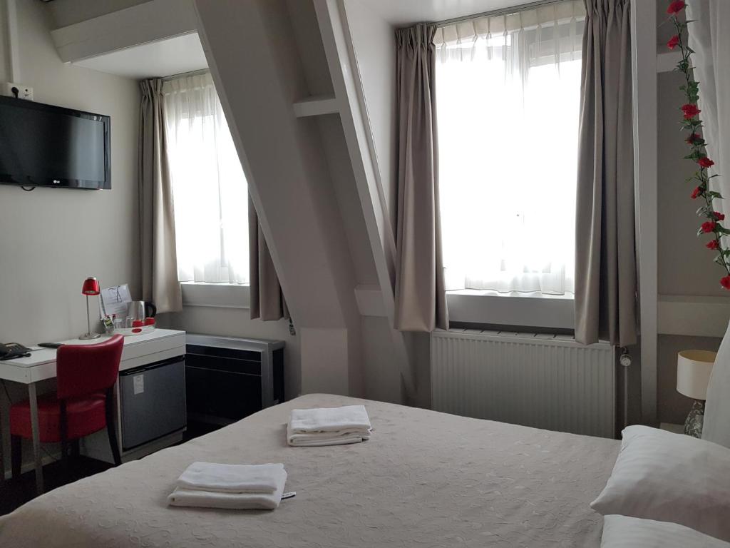 Postel nebo postele na pokoji v ubytování Hotel Zilt