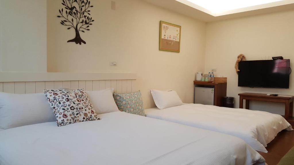 Postel nebo postele na pokoji v ubytování Summer Tree Homestay