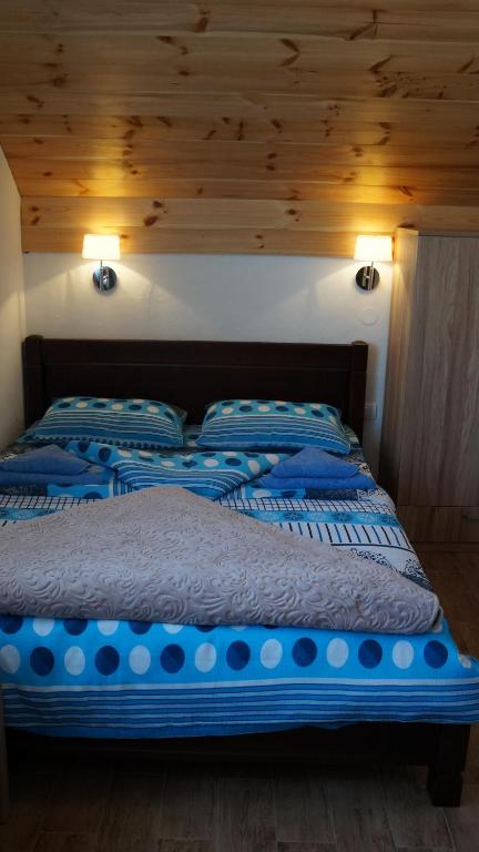 Un pat sau paturi într-o cameră la Rondović Apartmani - Durmitor