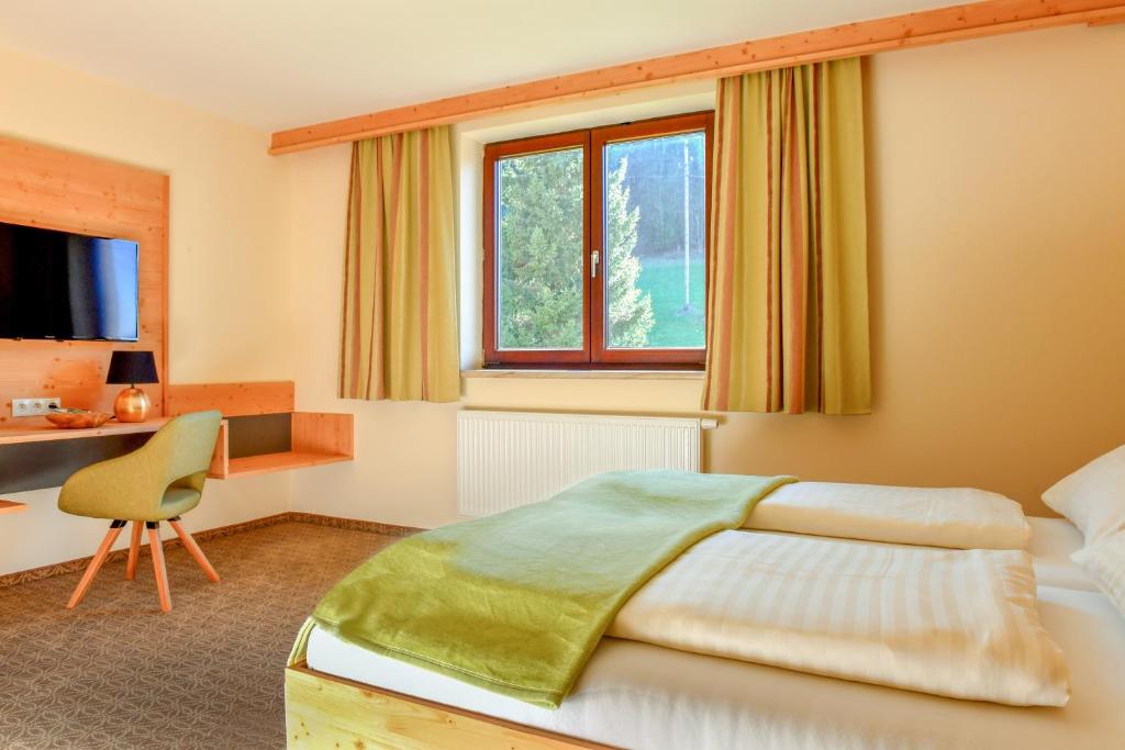 Säng eller sängar i ett rum på Gasthof Pension Seidl