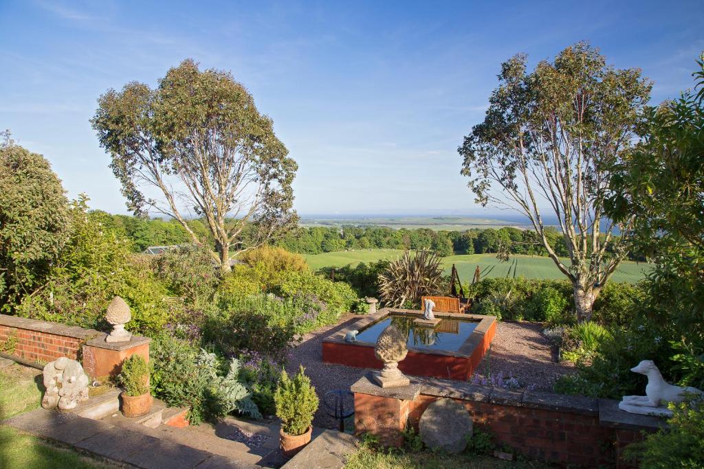 an aerial view of a garden with a pool at Cutty Sark Cottage in Kirkton of Largo