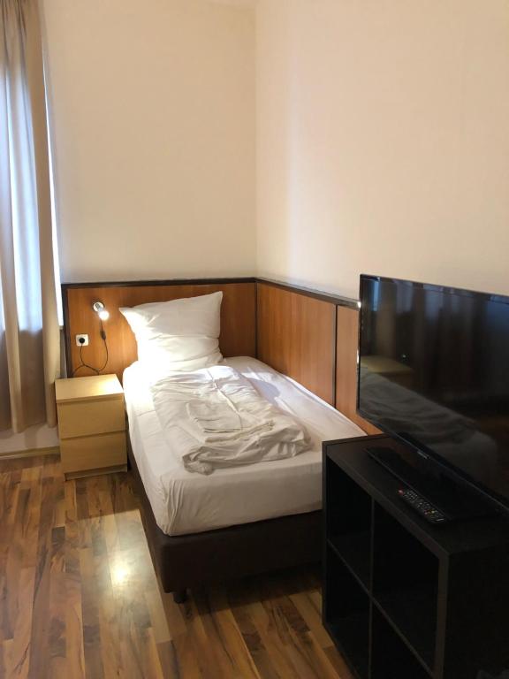Postel nebo postele na pokoji v ubytování Hotel Poseidon