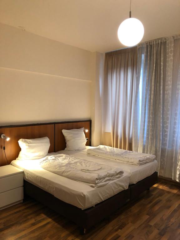Postel nebo postele na pokoji v ubytování Hotel Poseidon