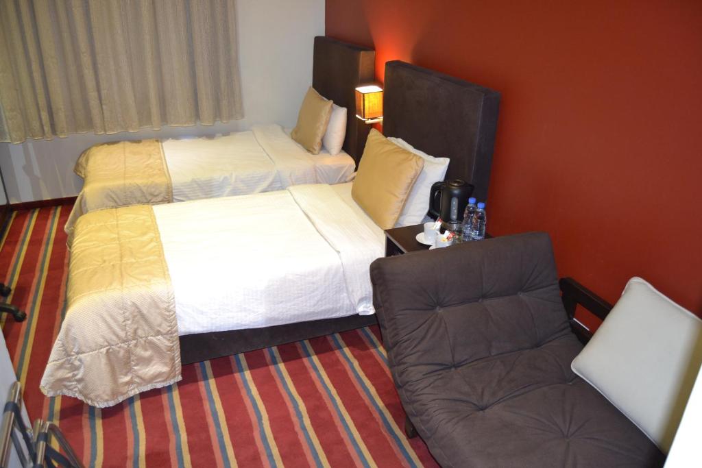 Postel nebo postele na pokoji v ubytování The J Hotel & Spa