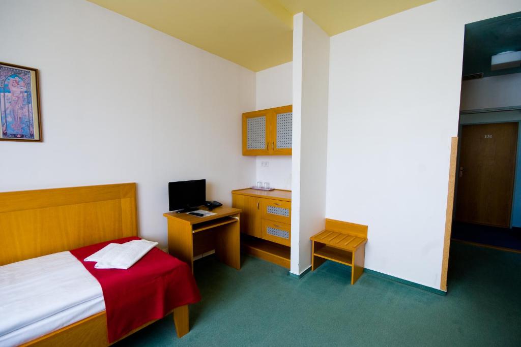 Postel nebo postele na pokoji v ubytování Hotel Smaragd