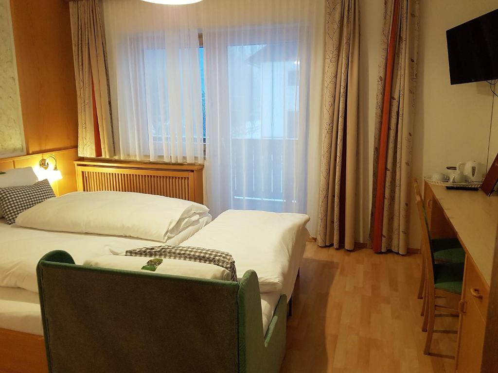 Postel nebo postele na pokoji v ubytování Haus Miriam