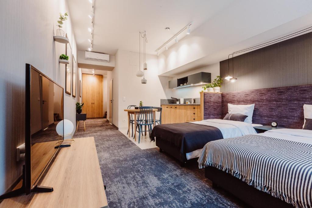 Televízia a/alebo spoločenská miestnosť v ubytovaní Mosquito Silesia Apartments