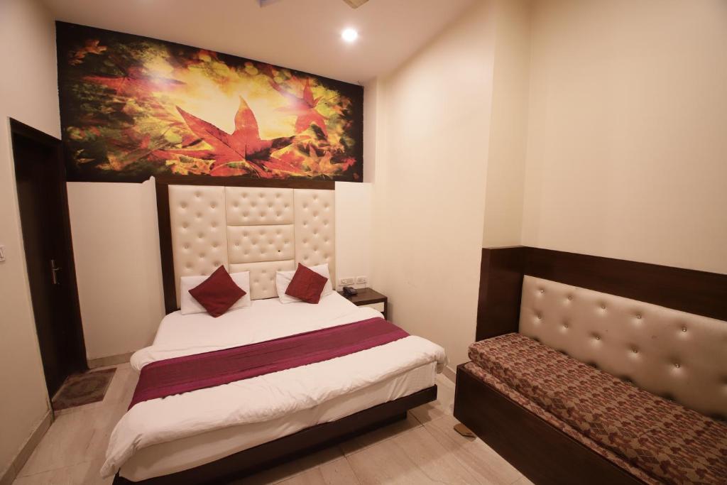 Postel nebo postele na pokoji v ubytování Hotel Golden Wings