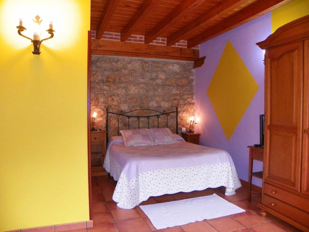 Postel nebo postele na pokoji v ubytování Posada Gema