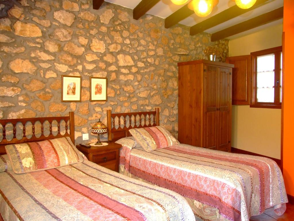 Postel nebo postele na pokoji v ubytování Posada Gema