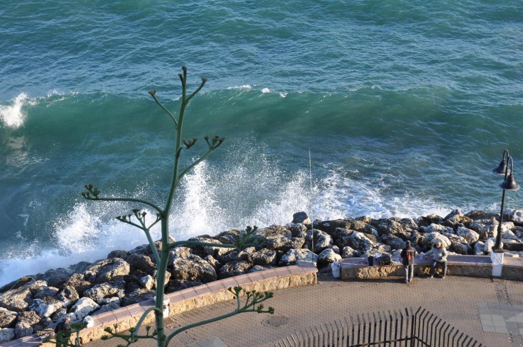 a group of rocks on the shore of the ocean at Studio Vue Mer in Torremolinos