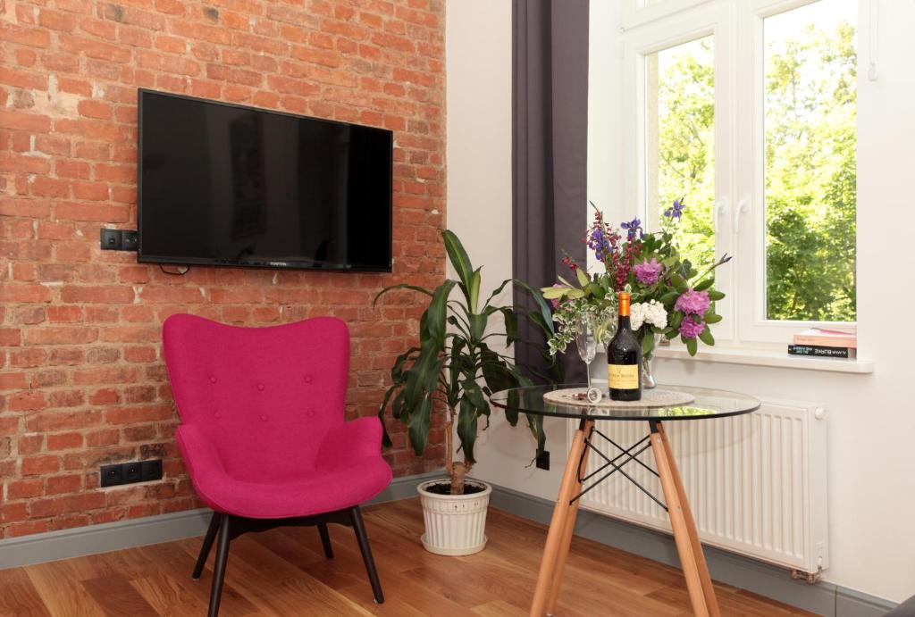 Televízia a/alebo spoločenská miestnosť v ubytovaní Sopot Ostsee Apartments
