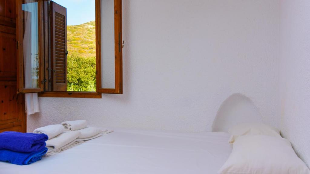 Postel nebo postele na pokoji v ubytování Elounda Island Villas
