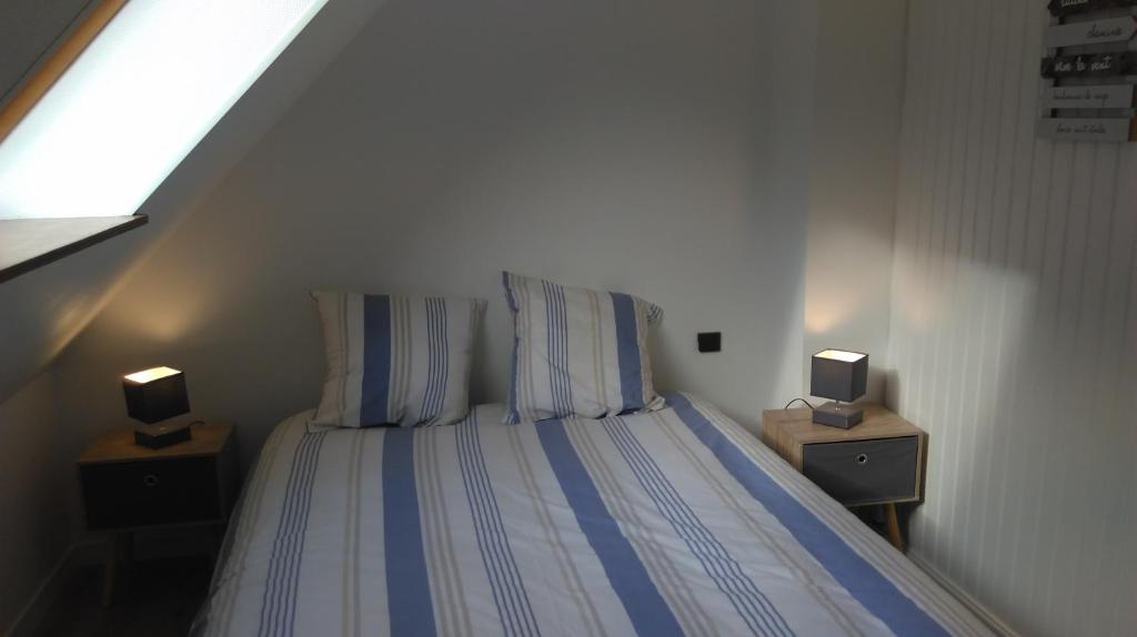 Säng eller sängar i ett rum på Appartement Bagnères de Luchon