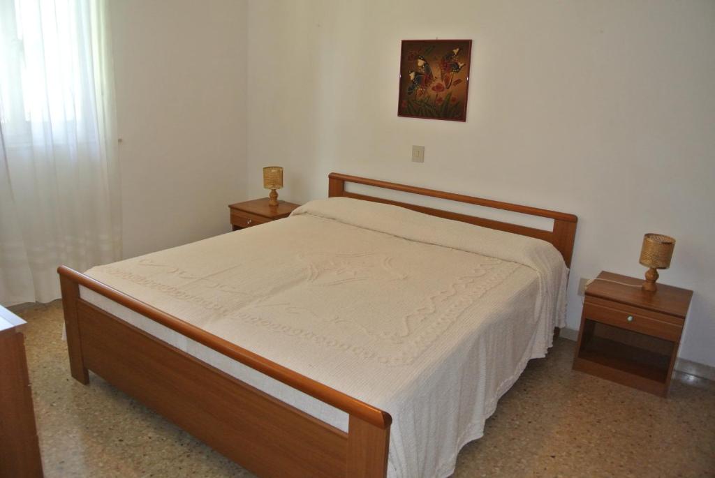 A bed or beds in a room at Condominio VILLA CHIARA