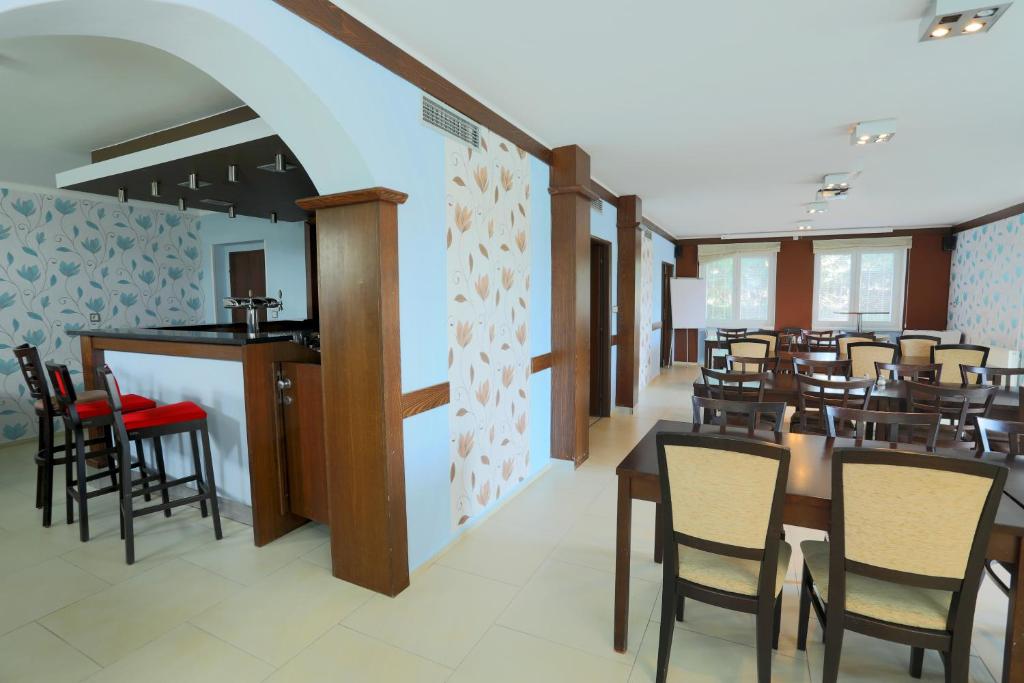 TV a/nebo společenská místnost v ubytování Hotel BRADA