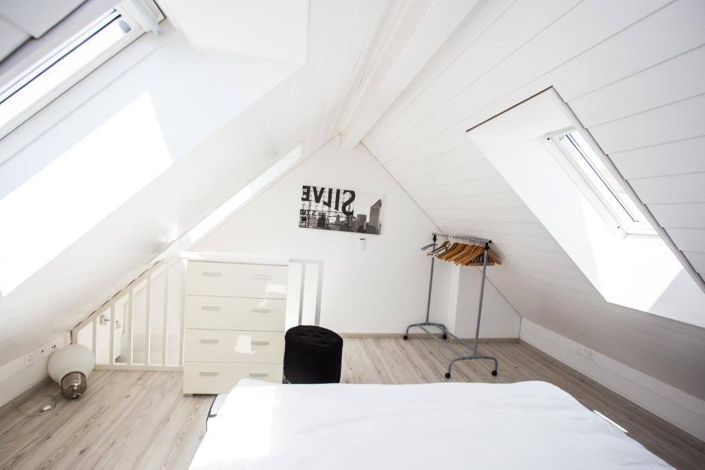 Voodi või voodid majutusasutuse Guest House Le Charlot toas