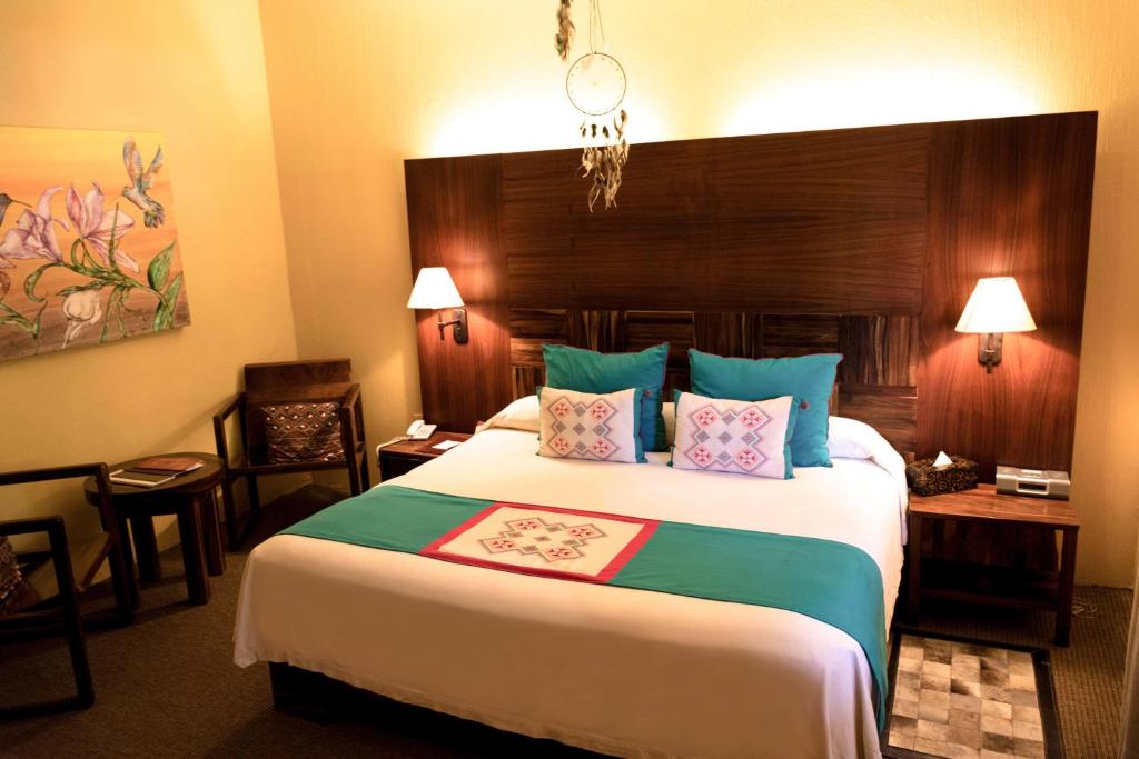 Postel nebo postele na pokoji v ubytování El Chante Spa Hotel