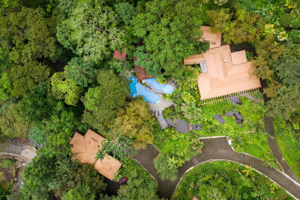 an overhead view of a house in the forest at Lost Iguana Resort and Spa in Fortuna