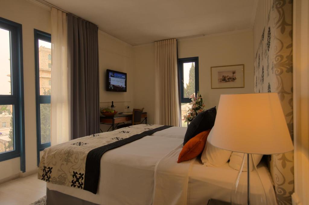 Postel nebo postele na pokoji v ubytování Eldan Hotel