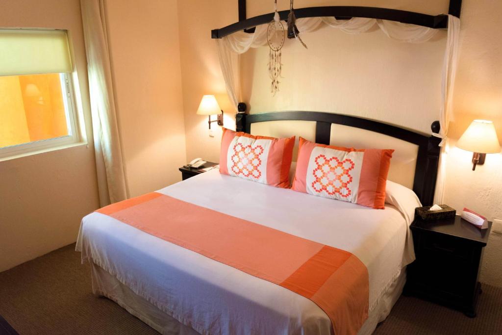 Postel nebo postele na pokoji v ubytování El Chante Spa Hotel
