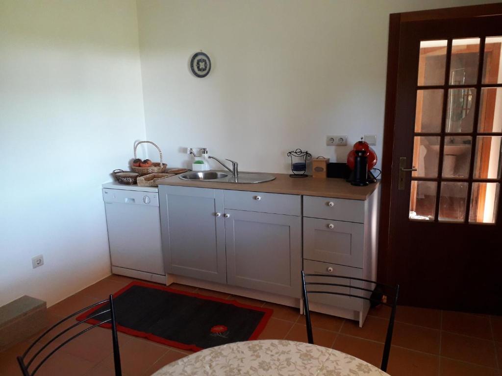 Kuchyň nebo kuchyňský kout v ubytování Casa da Farmácia