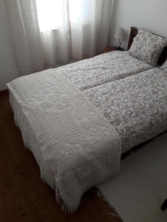Postel nebo postele na pokoji v ubytování Casa da Farmácia