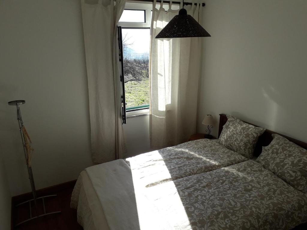 Postel nebo postele na pokoji v ubytování Casa da Farmácia