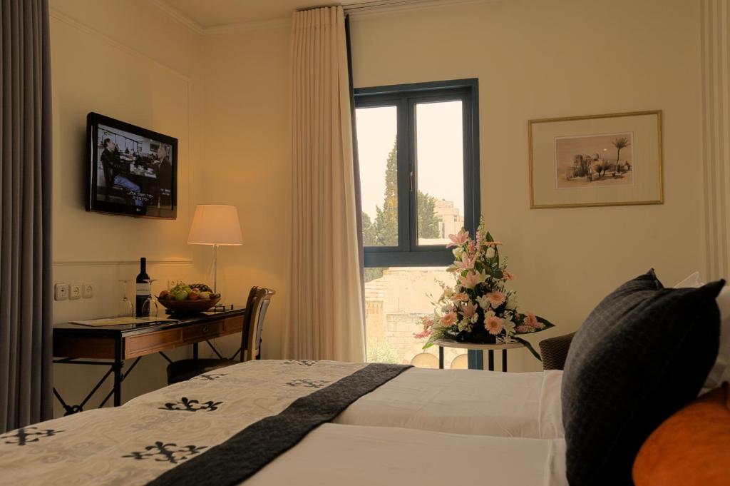 Postel nebo postele na pokoji v ubytování Eldan Hotel